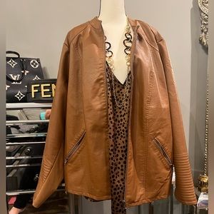 New Caramel motto jacket zips in the front the sleeves and the waist.